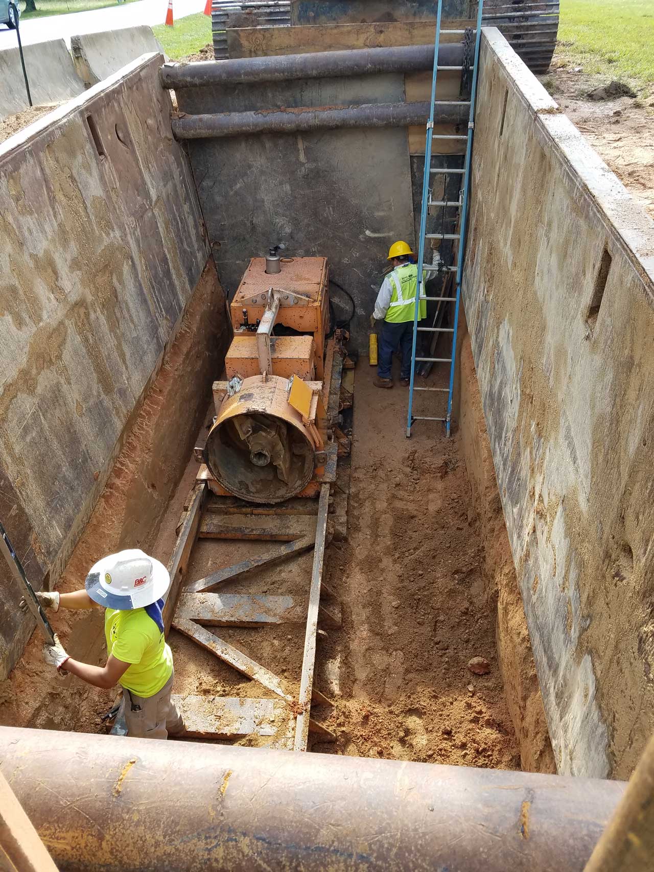 HALL Contracting Employees working in a bore pit
