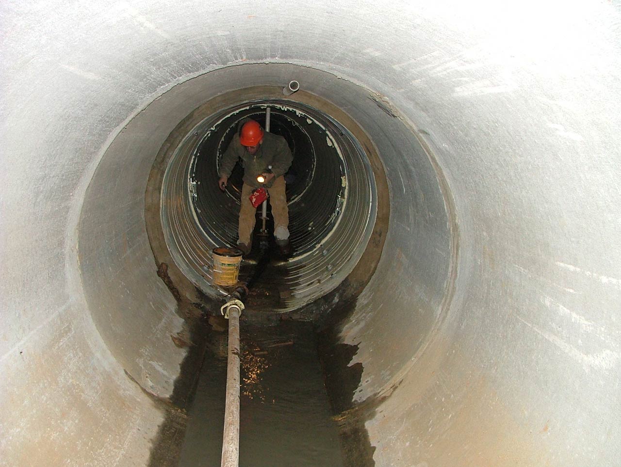 HALL employee at the end of the lined section of tunnel at the Concord Airport Project